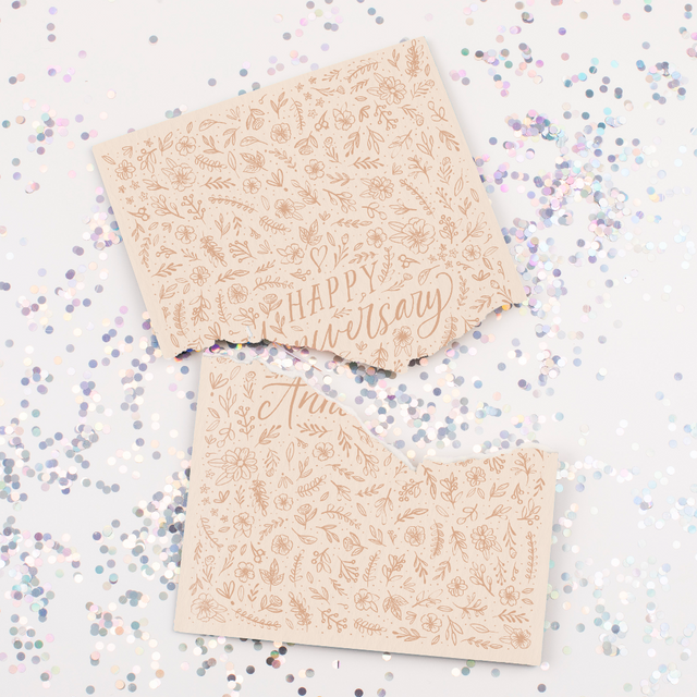 Endless musical anniversary card with elegant floral design and large glitter scattered around broken card from Joker Greeting