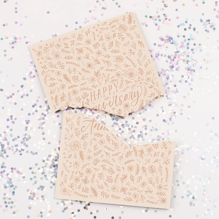 Endless musical anniversary card with elegant floral design and large glitter scattered around broken card from Joker Greeting