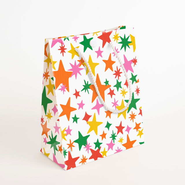 Side view of festive star-decorated endless mariachi musical gift bag showing vibrant multicolored star design and sturdy construction