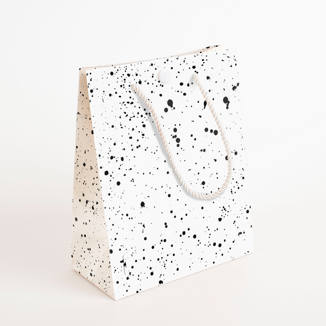 Black and white speckled musical gift bag with white rope handles from Joker Greeting endless scream collection
