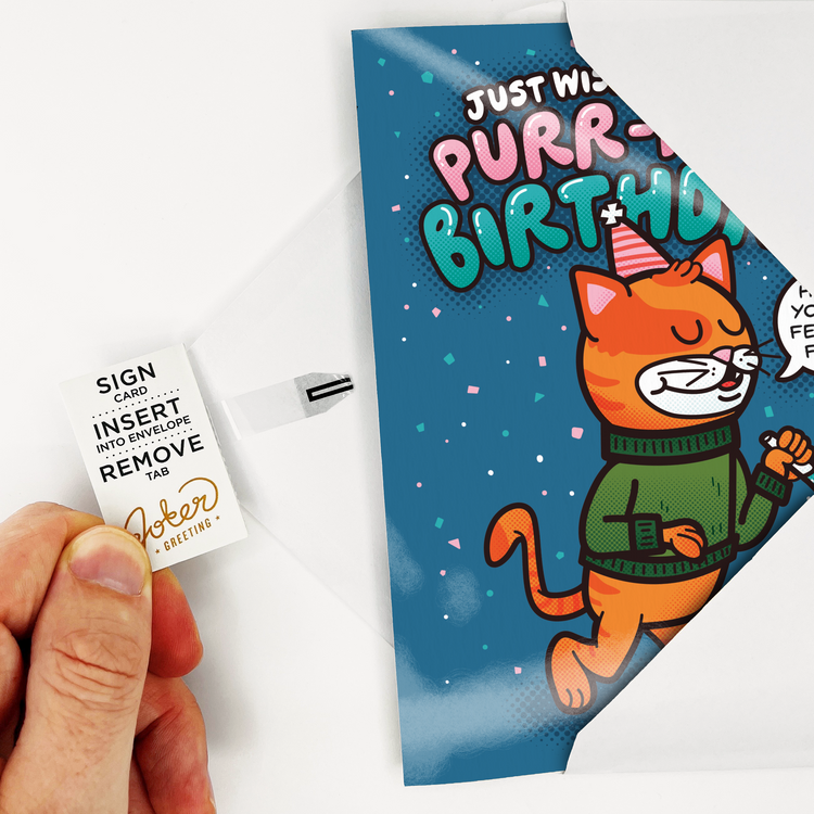 Tab Removal Demo:
Hand demonstrating how to remove activation tab from Cool Cat musical birthday card spine before placing in envelope for prank delivery