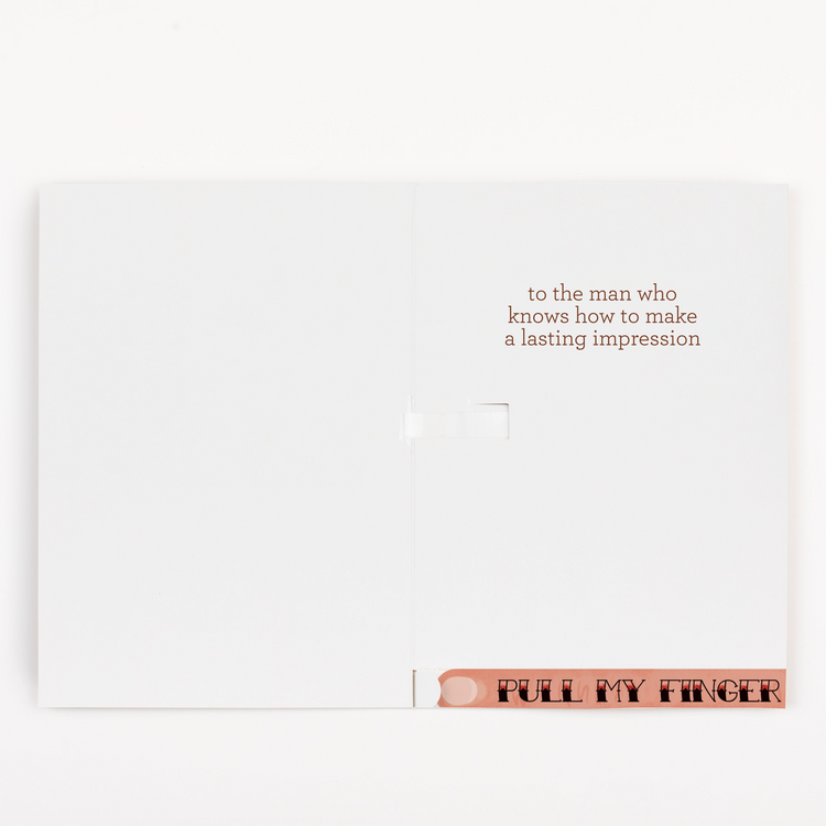 Open Father’s Day greeting card with message “to the man who knows how to make a lasting impression,” and a pull strip at the bottom that says "pull my finger" which will reveal chunky glitter and 5 stickers with puns on each sticker