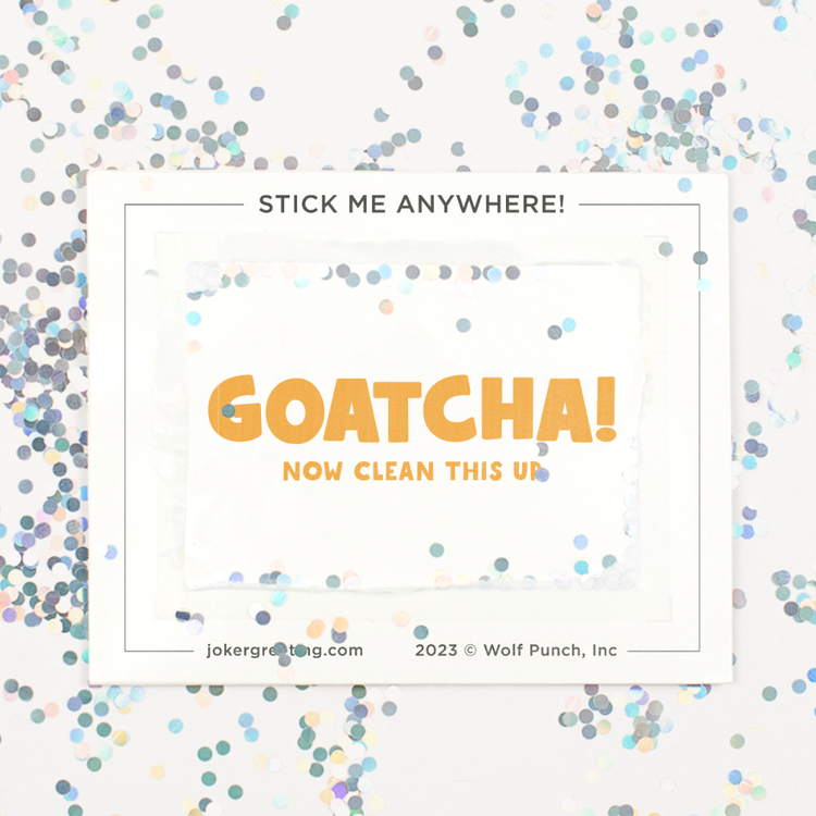 Backside of Joker Greeting goat prank device after removal with large glitter scattered around showing GOATCHA now clean this up secret message and stick me anywhere text