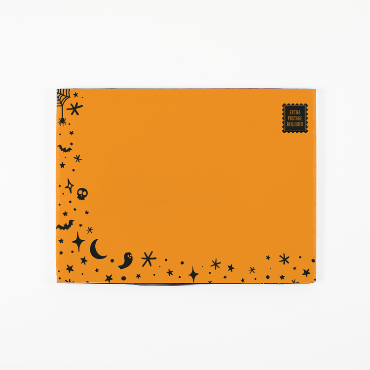 (Orange envelope closed): Orange Halloween glitter trap envelope by Joker Greeting with spooky themed design closed and ready for Halloween prank