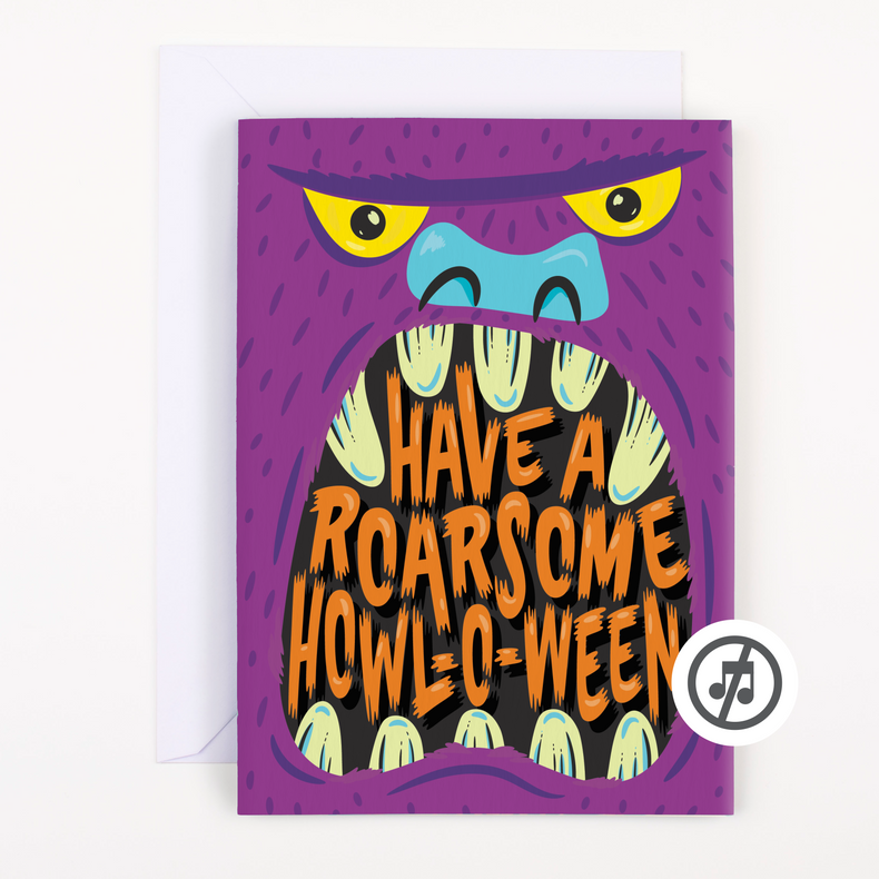 A greeting card with a cartoonish monster illustration in a vibrant purple and black color scheme, with the text 'HAVE A ROARSOME HOW-O-WEEN' and a pull strip on the top. There is a white envelope included with the card.
