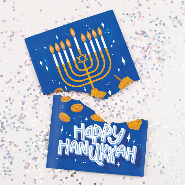 Musical Hanukkah greeting card torn apart showing menorah design with large glitter scattered and Happy Hanukkah message