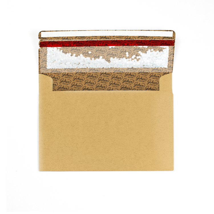 Envelope with branded interior visible): Joker Greeting kraft glitter envelope showing natural brown exterior with interior branding and prank mechanism