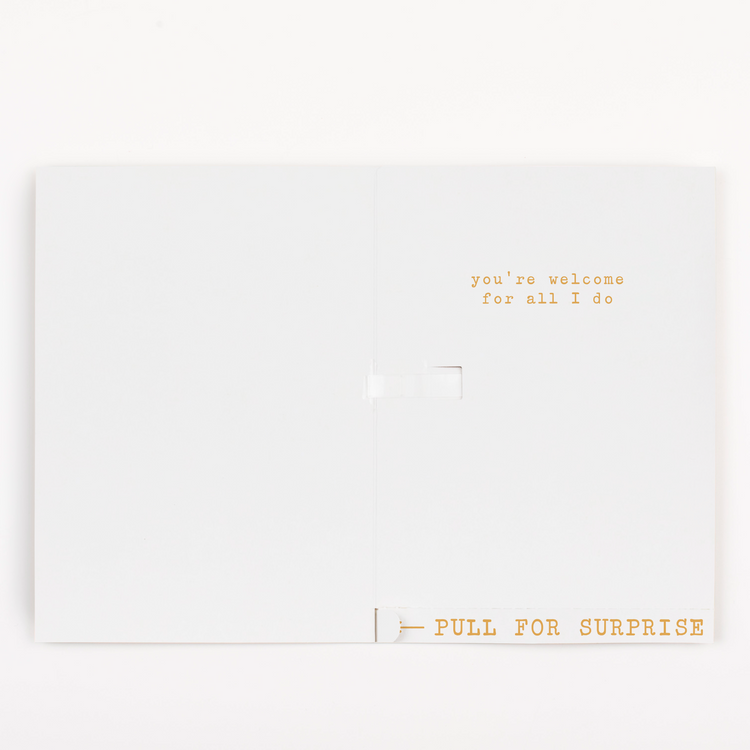 Interior view of Mother's Day card showing you're welcome for all I do message with pull for surprise tab and minimal glitter scattered around