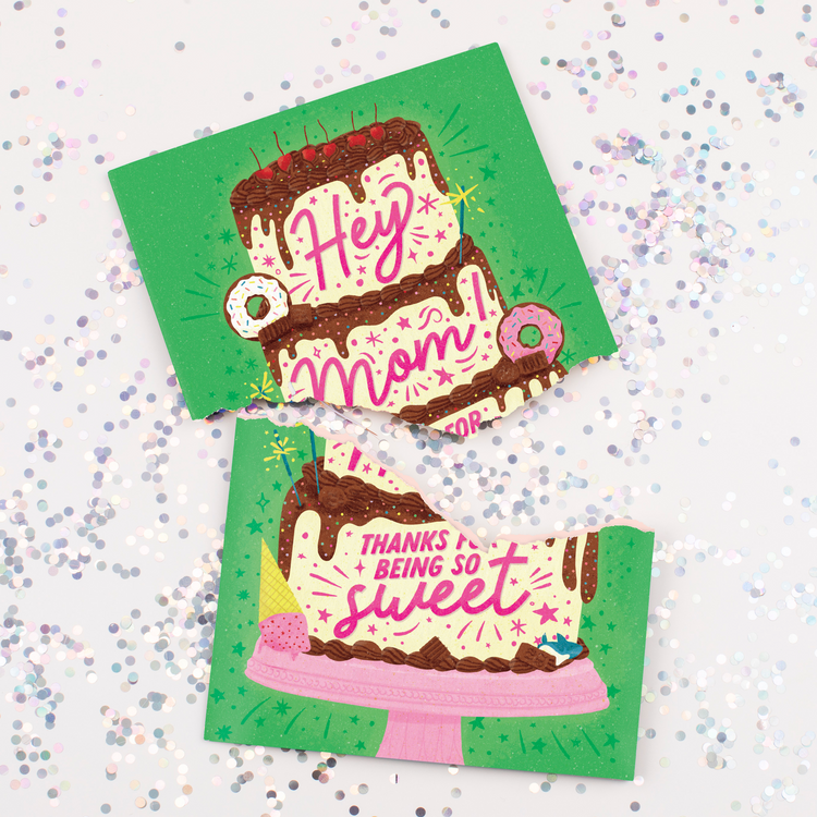 Torn musical Mother's Day card showing sweet chocolate cake design with Hey Mom text surrounded by colorful glitter showing glitter feature when damaged