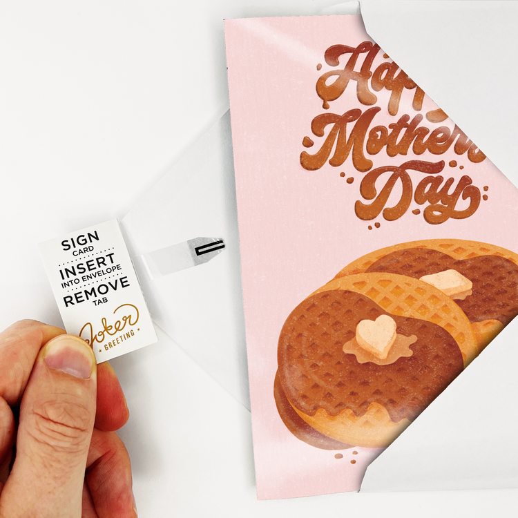 Hand holding Happy Mothers Day endless musical card with removal tab visible showing activation method for Rick Astley prank greeting card