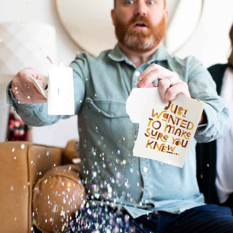 Man holding endless GOAT musical glitter card with surprised expression as large glitter sparkles fall around him showing Just Wanted To Make Sure You Knew message from Joker Greeting collection