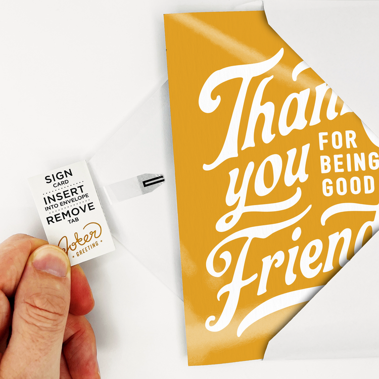 Hand pulling tab out of card to arm it