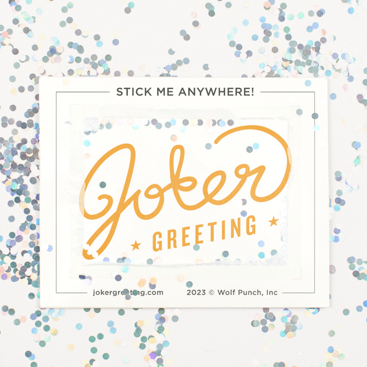 Backside of Joker Greeting cricket prank device after removal with large glitter scattered around