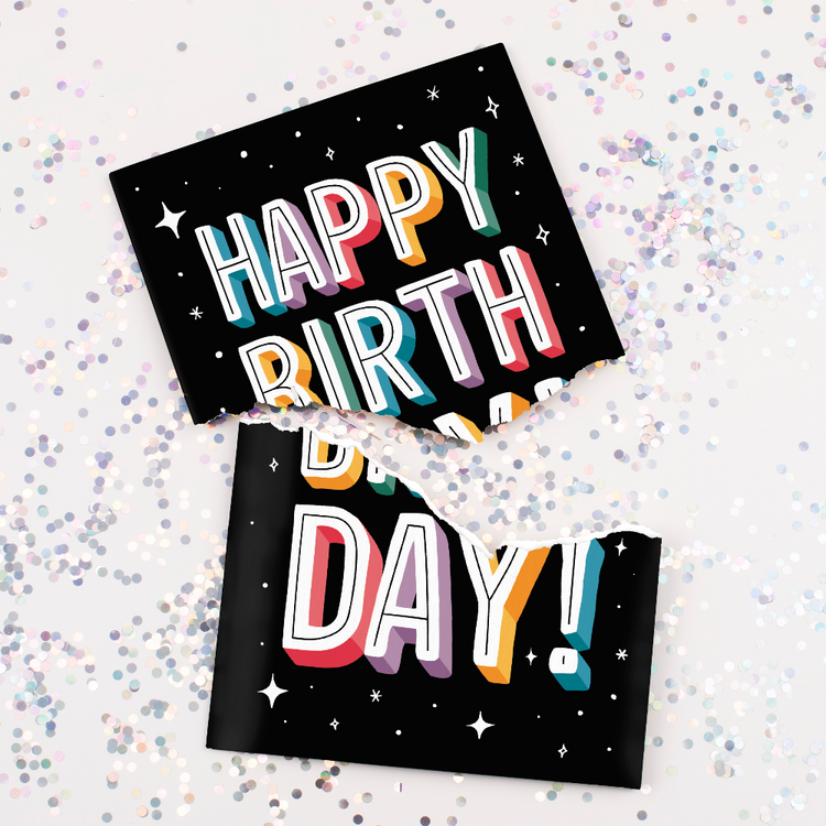 Torn Card with Glitter:
Recordable Happy Birthday musical card torn in half with multicolored glitter scattered around showing black starry design with colorful 3D letters and hidden glitter mess feature
