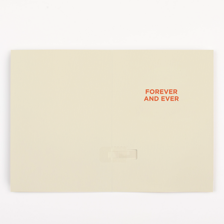Inside of endless musical Christmas card showing Forever and Ever text on cream background with tab removal system for activating Never Gonna Give You Up song