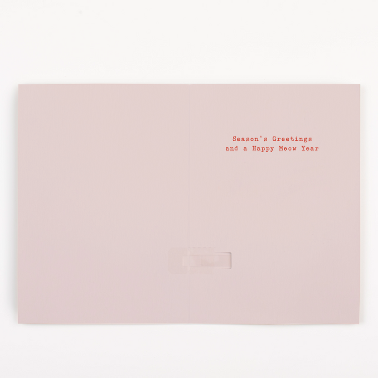 Holiday greeting card interior showing Seasons Greetings and a Happy Meow Year message on pink background with cat puns