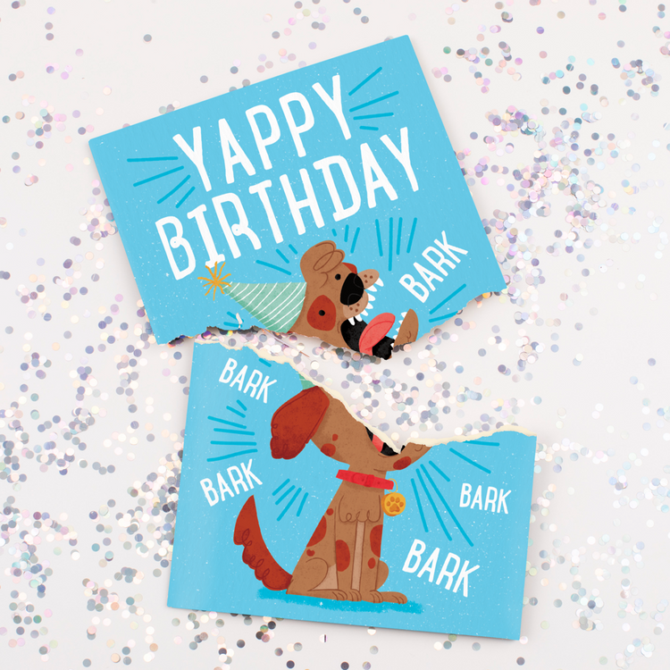 Torn Card with Glitter:
Yappy Birthday dog musical card torn in half with multicolored glitter scattered around showing cartoon dog design and hidden glitter mess feature