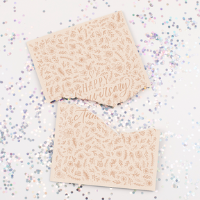 Endless musical anniversary card with elegant floral design and large glitter scattered around broken card from Joker Greeting