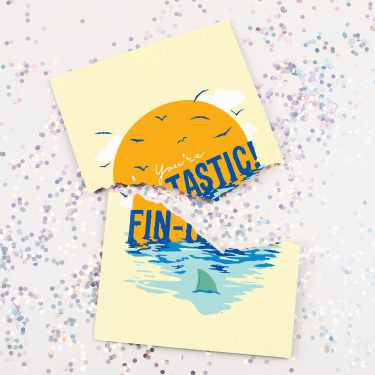 Fin-Tastic Baby Shark musical glitter cards surrounded by large colorful glitter pieces showing prank greeting card collection