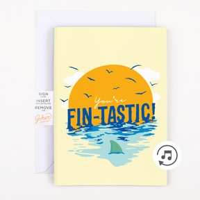 Fin-Tastic Baby Shark musical prank card with yellow ocean sunset design showing front cover with musical note icon and Joker Greeting branding