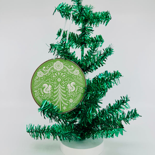 Hanging an ornament on a tree