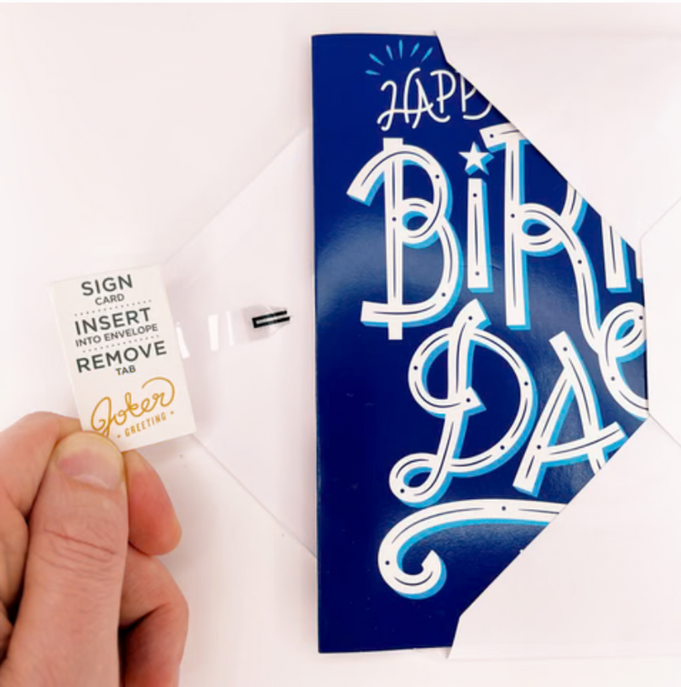 Joker Greeting endless blue birthday card partially inside envelope with musical note icon how to arm and prepare. 