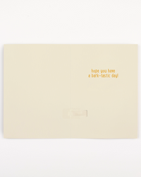 Beige card with gold text 'hope you have a bark-tastic day!' on a white background