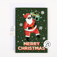 A Christmas greeting card with an illustration of Santa Claus holding a boombox, playing a song titled 'Never Gonna Give You Up'. The card has 'Merry Christmas' text and glitter embellishments.