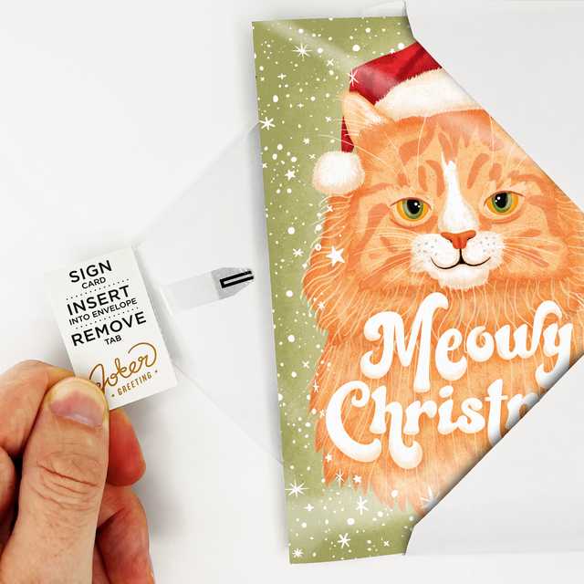Joker Greeting Meowy Christmas musical card featuring orange tabby cat in Santa hat with Joker Greeting branding and musical note icon