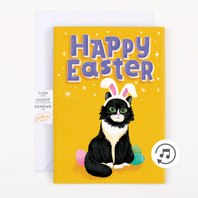 A greeting card with a illustration of a black cat wearing bunny ears, surrounded by Easter eggs, with the text 'Happy Easter' on a yellow background. There is also a musical note symbol indicating the card plays a tune.