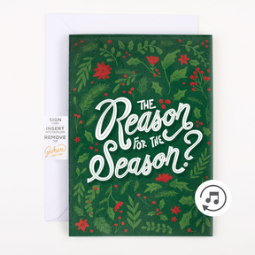 A Christmas themed greeting card with green background, red and white accents, and text reading 'The Reason for the Season?'. There is a white envelope included and a graphic indicating a sound file.