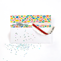 Colorful patterned pouch with a red strap on a white background Farting Glitter Envelope