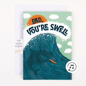 Father's Day Greeting card that says "Dad, You're Swell" with a surfer on a wave and a shark underneath the water