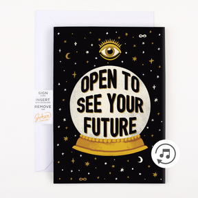 A greeting card with a fortune-telling theme, featuring text 'OPEN TO SEE YOUR FUTURE' on a circular object, against a black background with stars and a eye graphic.