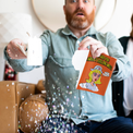 Man ripping the get well soon card apart.