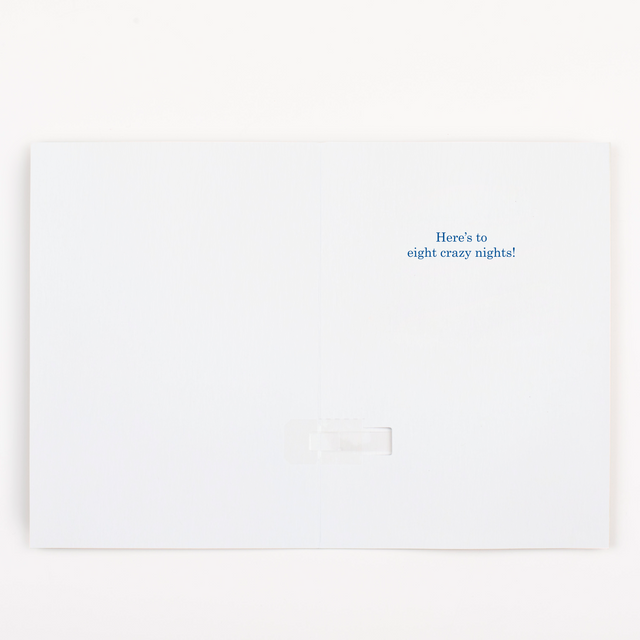 Hanukkah card opened showing here's to eight crazy nights message with Festival of Lights celebration theme