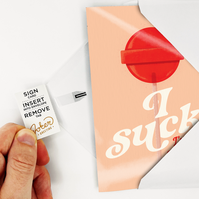 Hand removing tab from card showing how to arm the card. 