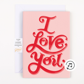 A greeting card with 'I Love You' text in red script on a pink background, featuring a pull strip surprise mechanism.