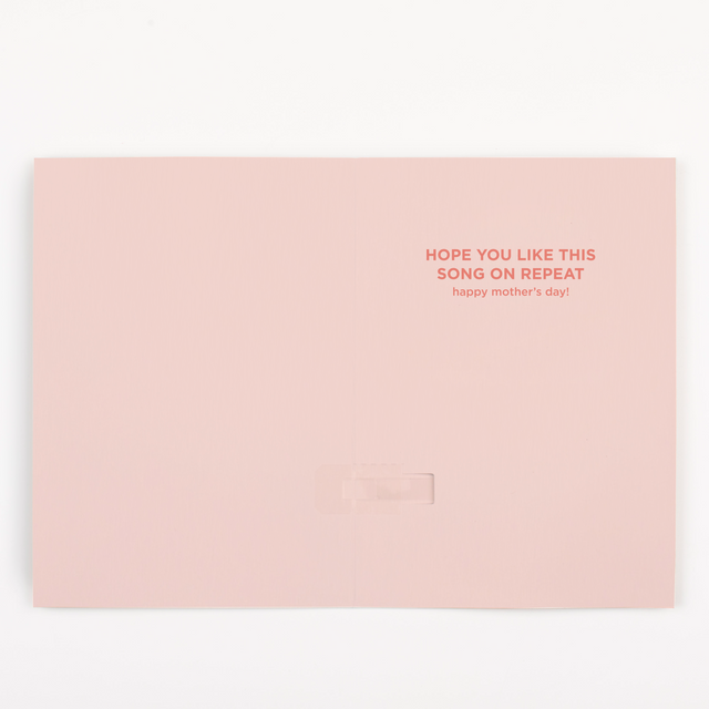 : Interior of Mother's Day card showing pink background with Hope you like this song on repeat happy mother's day message