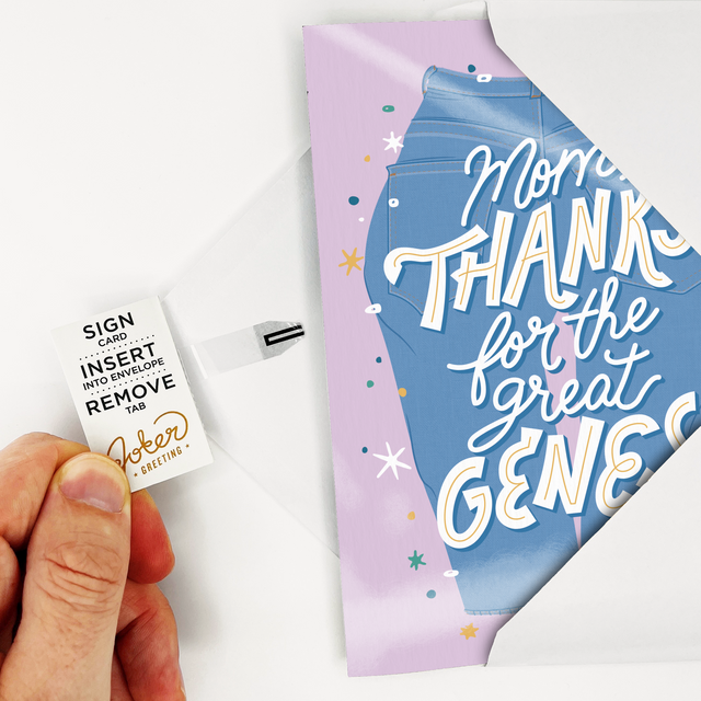  Hand holding Joker Greeting pull tab for endless Mother's Day fart sound card showing Mom Thanks for the great genes text on denim design