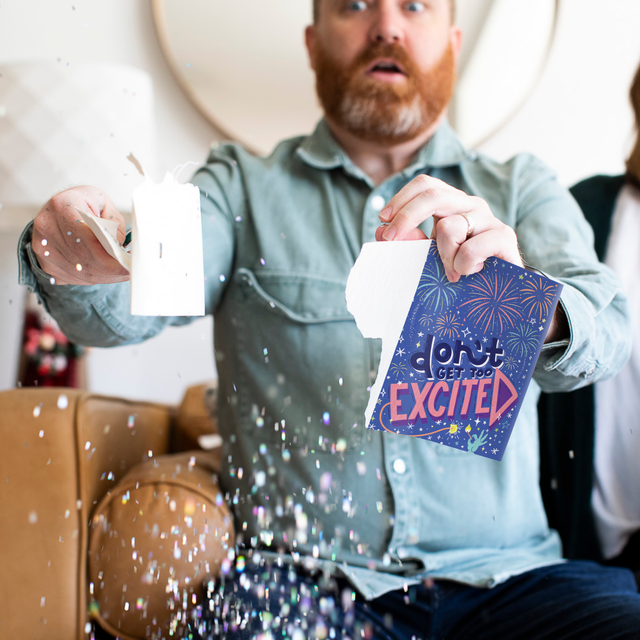 Man Ripping Card to show glitter effect