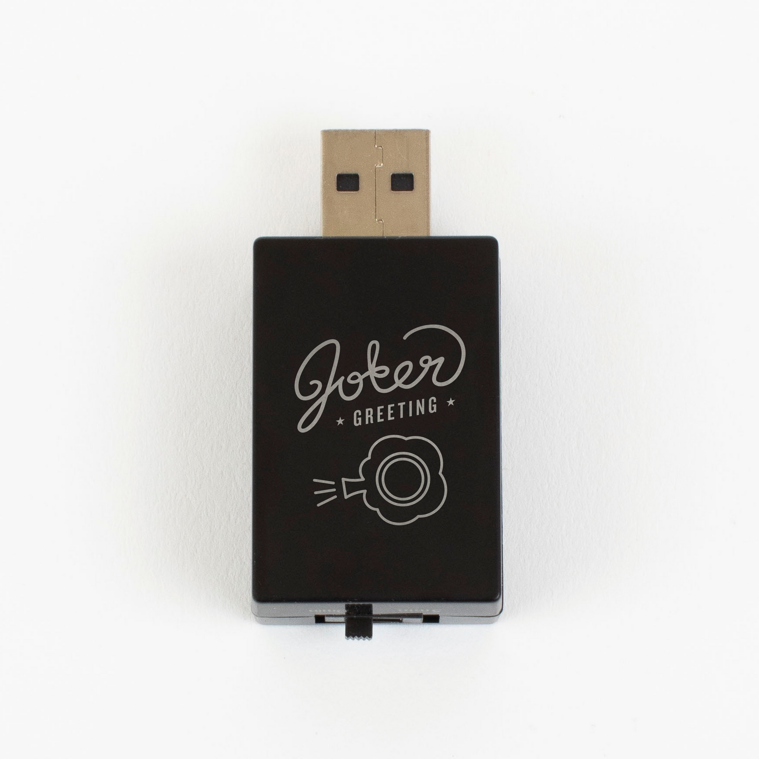 Black USB fart sound prank device with Joker Greeting logo and toot cloud icon showing USB Type-A connector