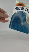 Video on how to setup and use the Father's Day Prank card. Just sign the card then remove the tab on the spine, then give the card. It will begin and play nonstop after it's opened. 